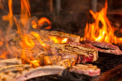 overcooked-meat-steaks-into-flames-grill-min